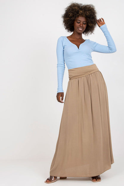 Model wearing Och Bella Casual Maxi Skirt as a dress, demonstrating its versatile styling options and the elegant silhouette it creates.
