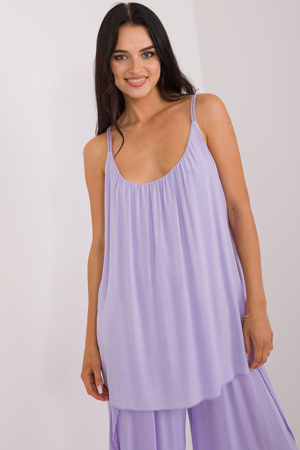 Och Bella's stylish strapless blouse, crafted from 100% viscose, showcasing a sophisticated design ideal for warm weather.