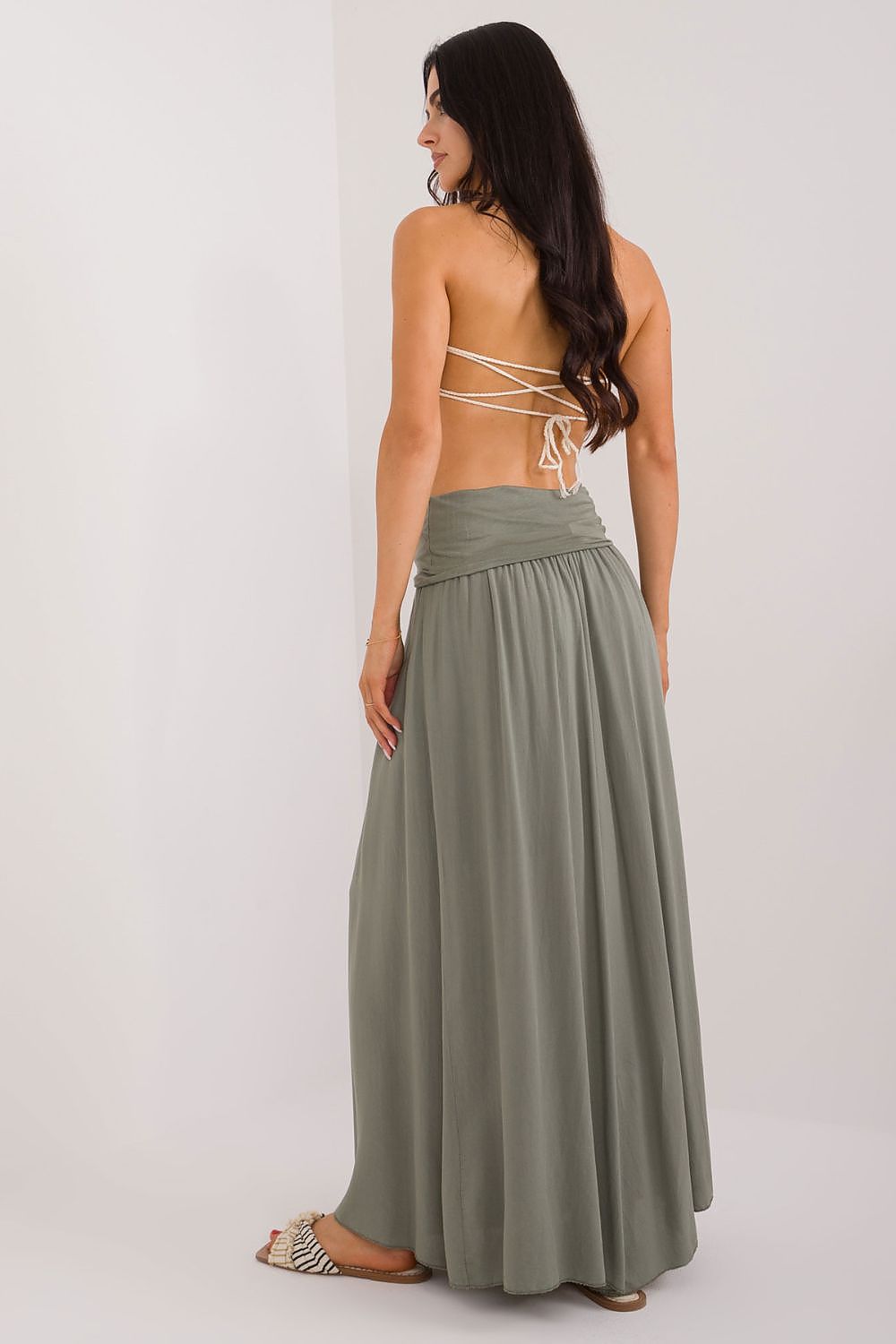 Detailed view of the decorative creases on the Och Bella maxi skirt, capturing its unique character and sophisticated style.