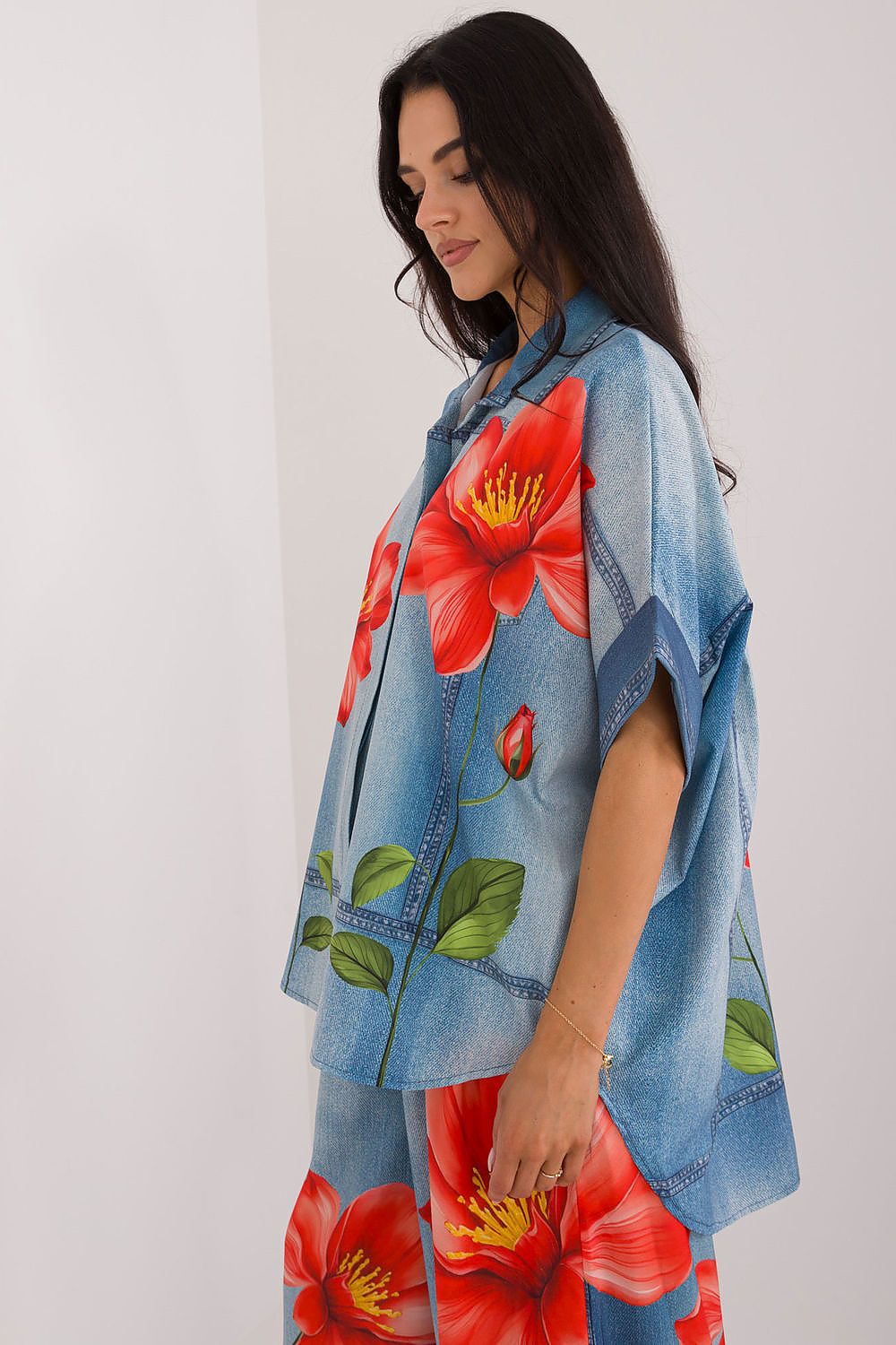 Flat lay of Italy Moda's colourful short sleeve women's shirt, displaying its vibrant pattern and sophisticated style.