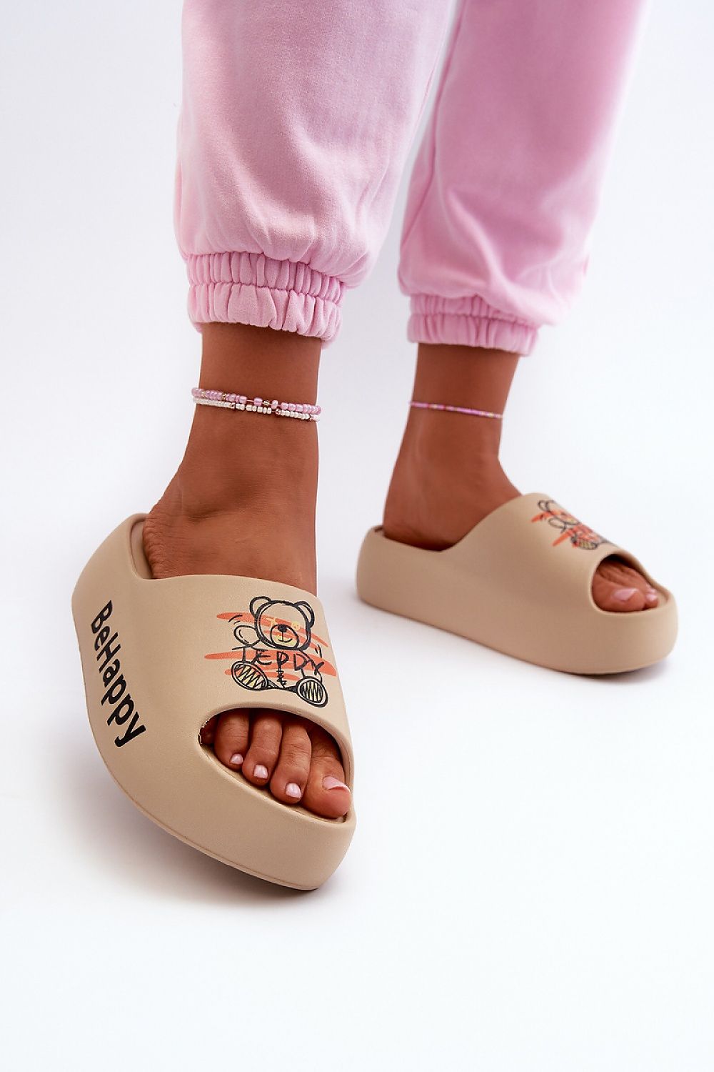 Chic women's holiday flip-flops with a unique teddy bear print by Step in Style, combining luxury and comfort.