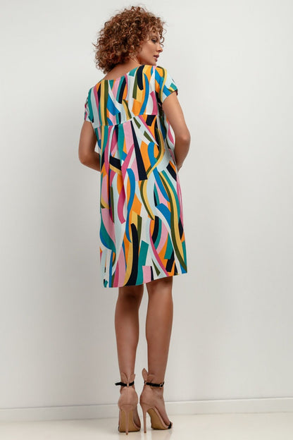 Elegant Tessita dress styled for a formal event, featuring high-quality viscose material that offers comfort and style.