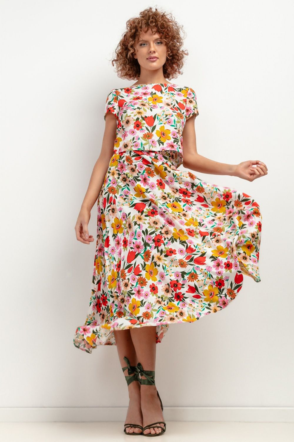 Model wearing the Tessita elegant viscose maxi skirt, styled for an upscale summer event, capturing the flow and elegance of the garment.