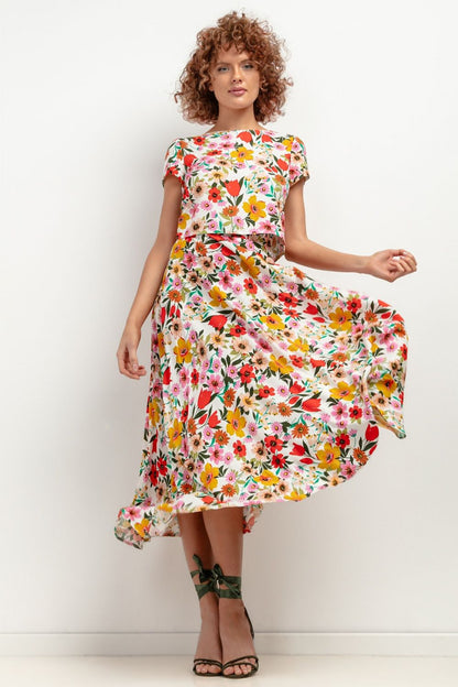 Model wearing the Tessita elegant viscose maxi skirt, styled for an upscale summer event, capturing the flow and elegance of the garment.