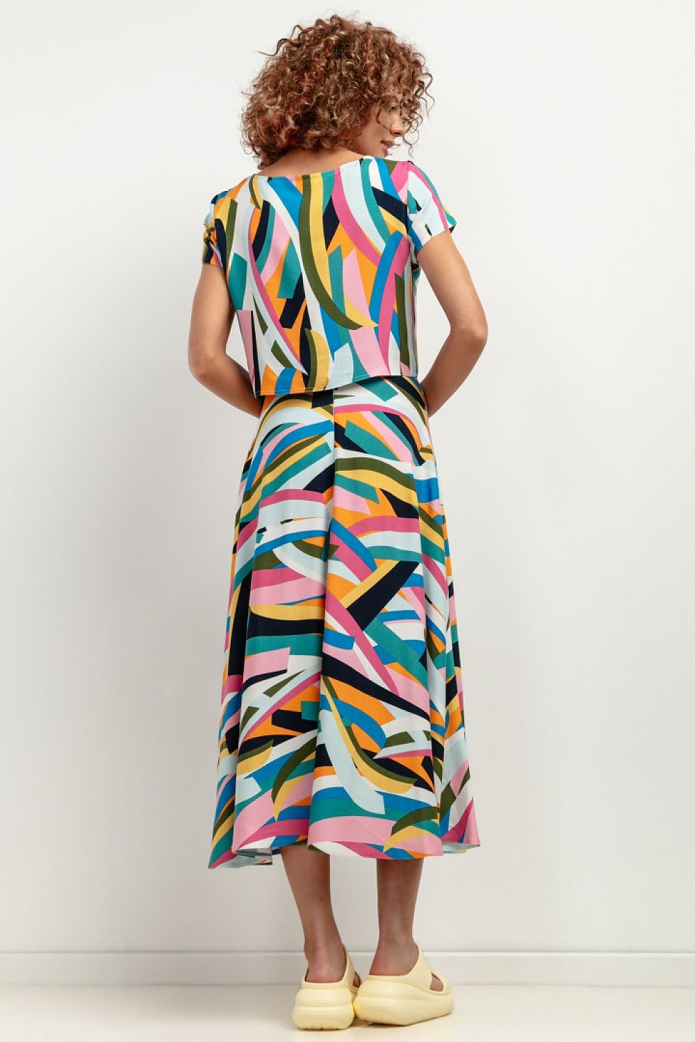 Elegant maxi viscose skirt by Tessita, showcasing a stunning patterned design, perfect for summer wear.