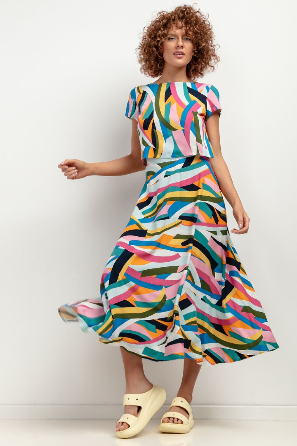 Tessita T408 viscose patterned blouse draped gracefully on a hanger, showcasing its lightweight structure and exquisite patterns that epitomise summer sophistication.