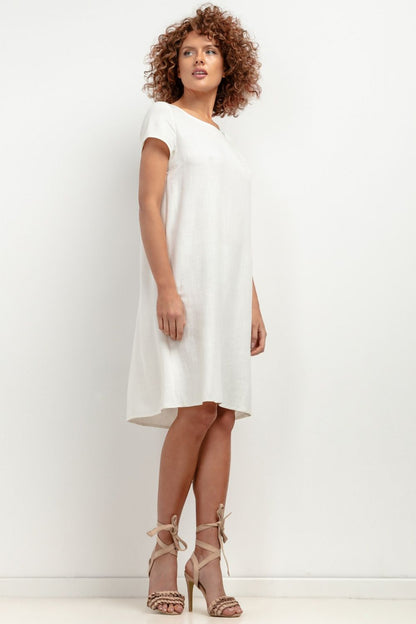 Elegant Tessita T403 linen dress hanging elegantly, featuring airy design and comfortable fit, ideal for summer outings.