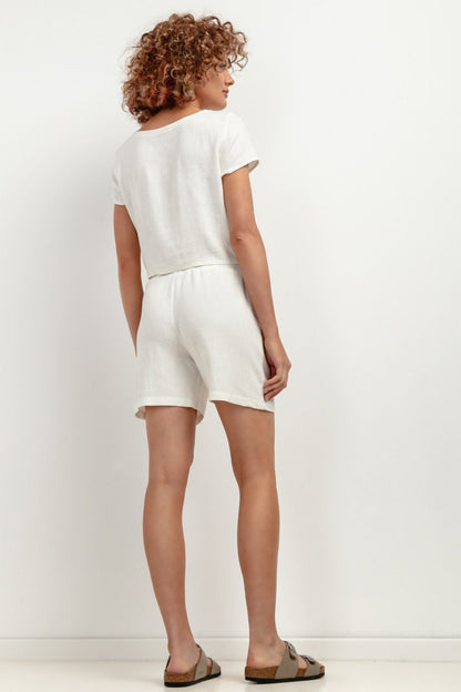 Tessita T402 linen shorts styled with a complementary top, epitomising elegance and comfort for summer fashion.