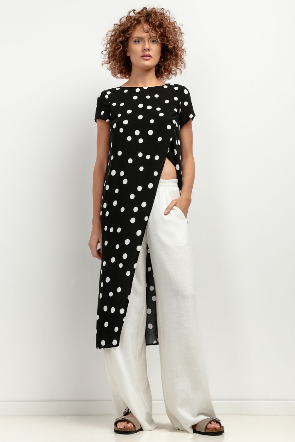 Tessita Women's Viscose Tunic T410 worn over swimwear, illustrating its versatility as a chic beach cover-up.