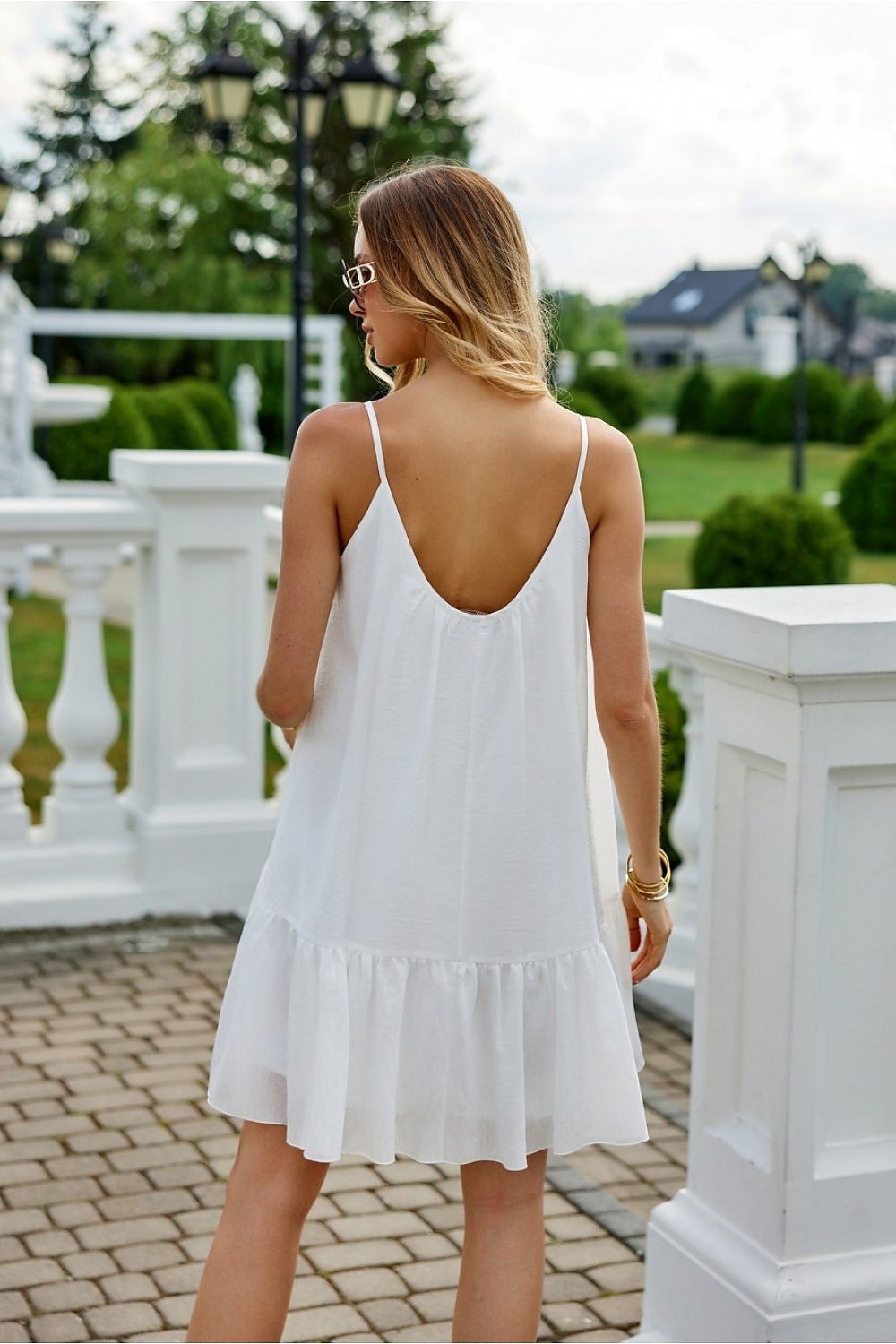 Elegant strapless summer dress from Roco Fashion featuring a charming frill and designed for comfort in warm weather.