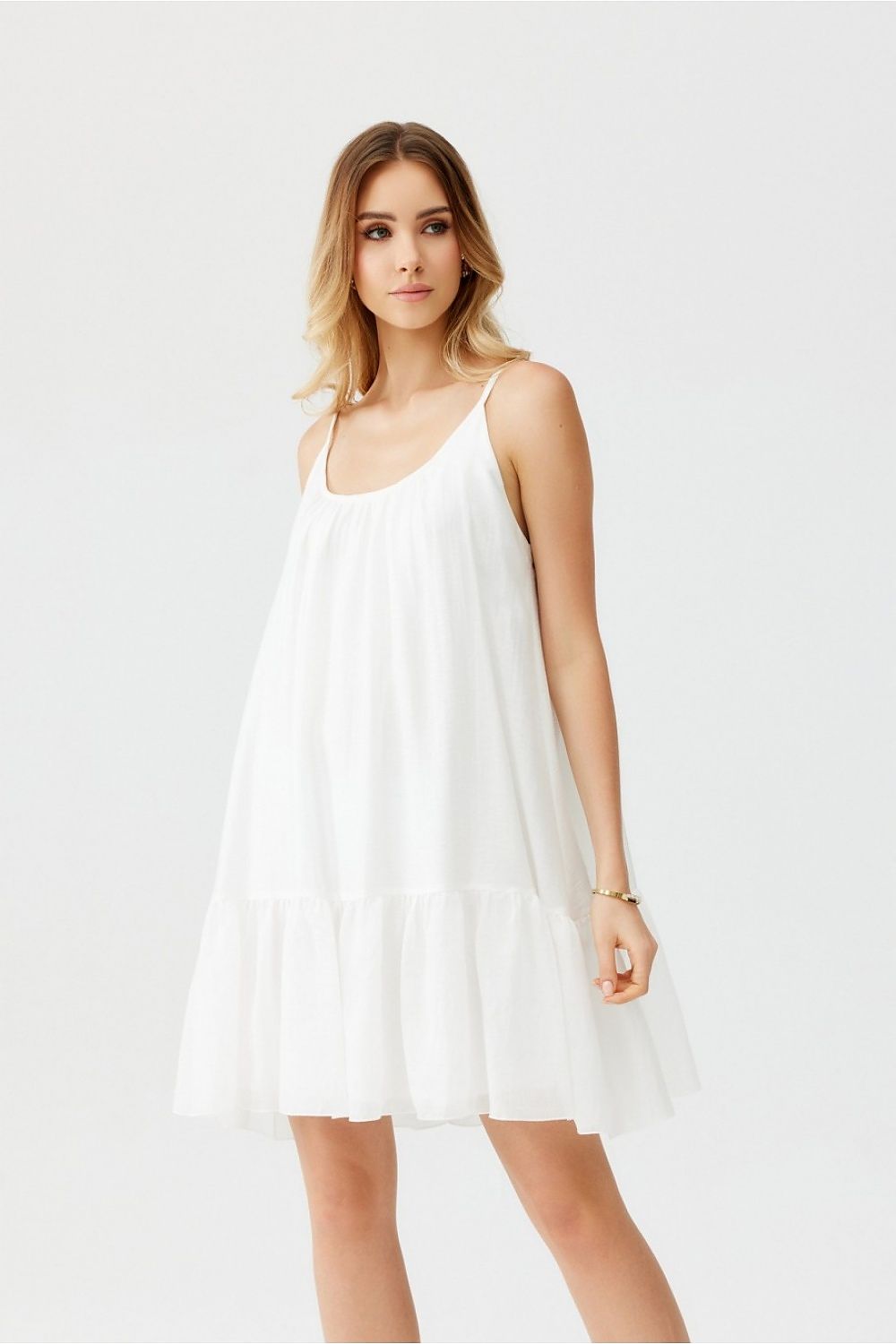 Chic strapless dress by Roco Fashion, showcasing a modern shape with a delightful frill, perfect for summer occasions.