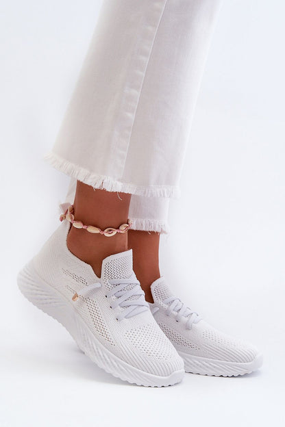 Elegant women's slip-on sports shoes by Step in Style, featuring a stylish textile upper and rubber bands mimicking laces for a sporty yet sophisticated look.