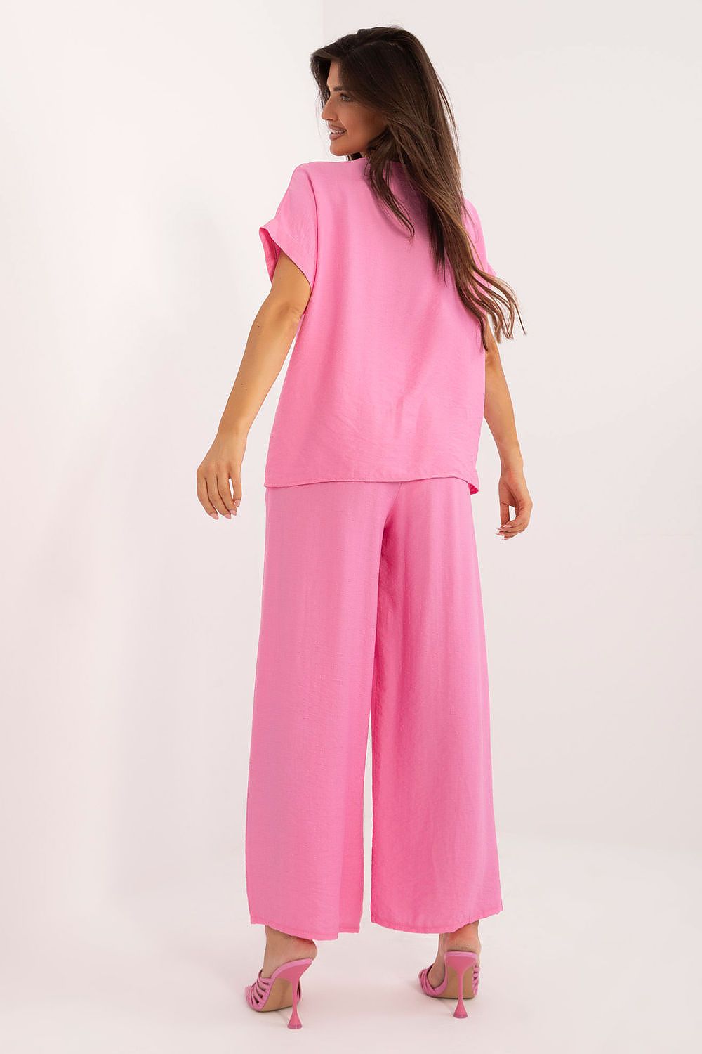 Stylish high-waisted wide-leg trousers with a tie belt and pockets, designed by Italy Moda for a sophisticated everyday look.