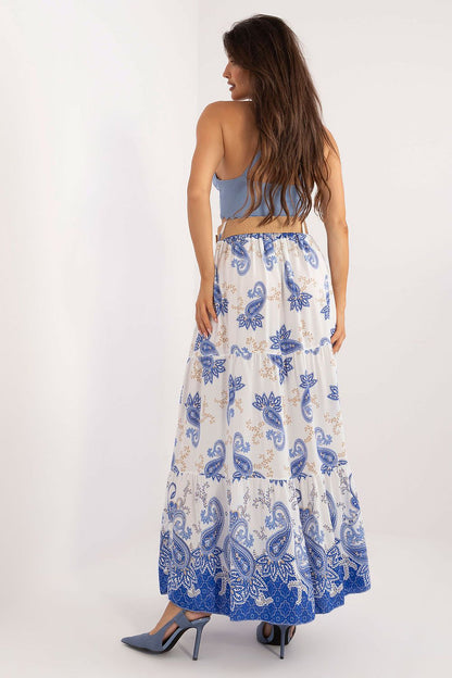 Italy Moda's luxurious maxi skirt featuring a delicate ruffled hem and bright, cheerful print, perfect for casual styling.