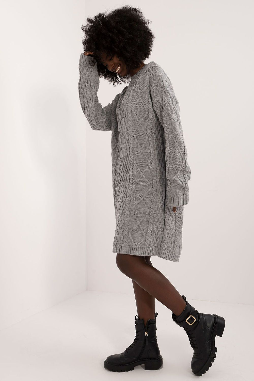Model wearing the stylish knee-length daydress by Badu, highlighting its comfortable fit and long sleeves for cooler days.