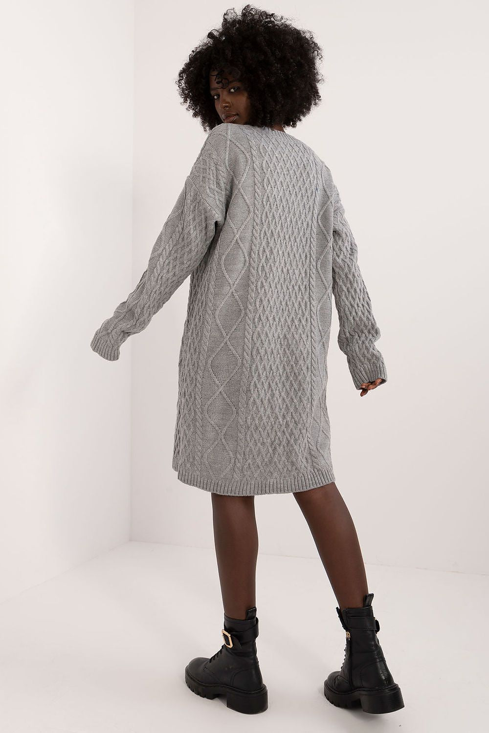 Flat lay of Badu's luxurious knee-length daydress, demonstrating the rich fabric blend of acrylic and wool.