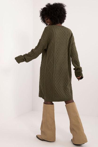 Detailed view of Badu's knee-length daydress, showcasing the unique knit texture and feminine round neckline, ideal for sophisticated everyday wear.