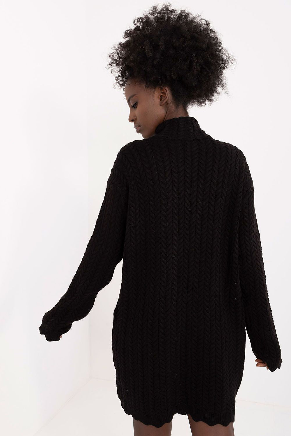 Signature mini knitted dress by Badu, showcasing a sophisticated design with a turtleneck and a fashionable silhouette for versatile everyday style.