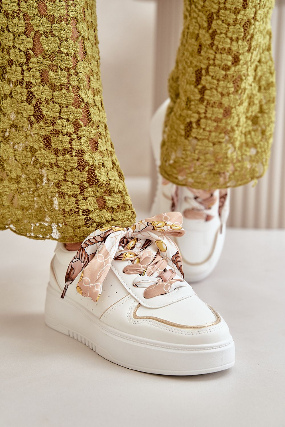 Chic eco leather women's sneakers by Step in Style, designed with a comfortable 3.5cm platform and stylish decorative lacing for effortless elegance.