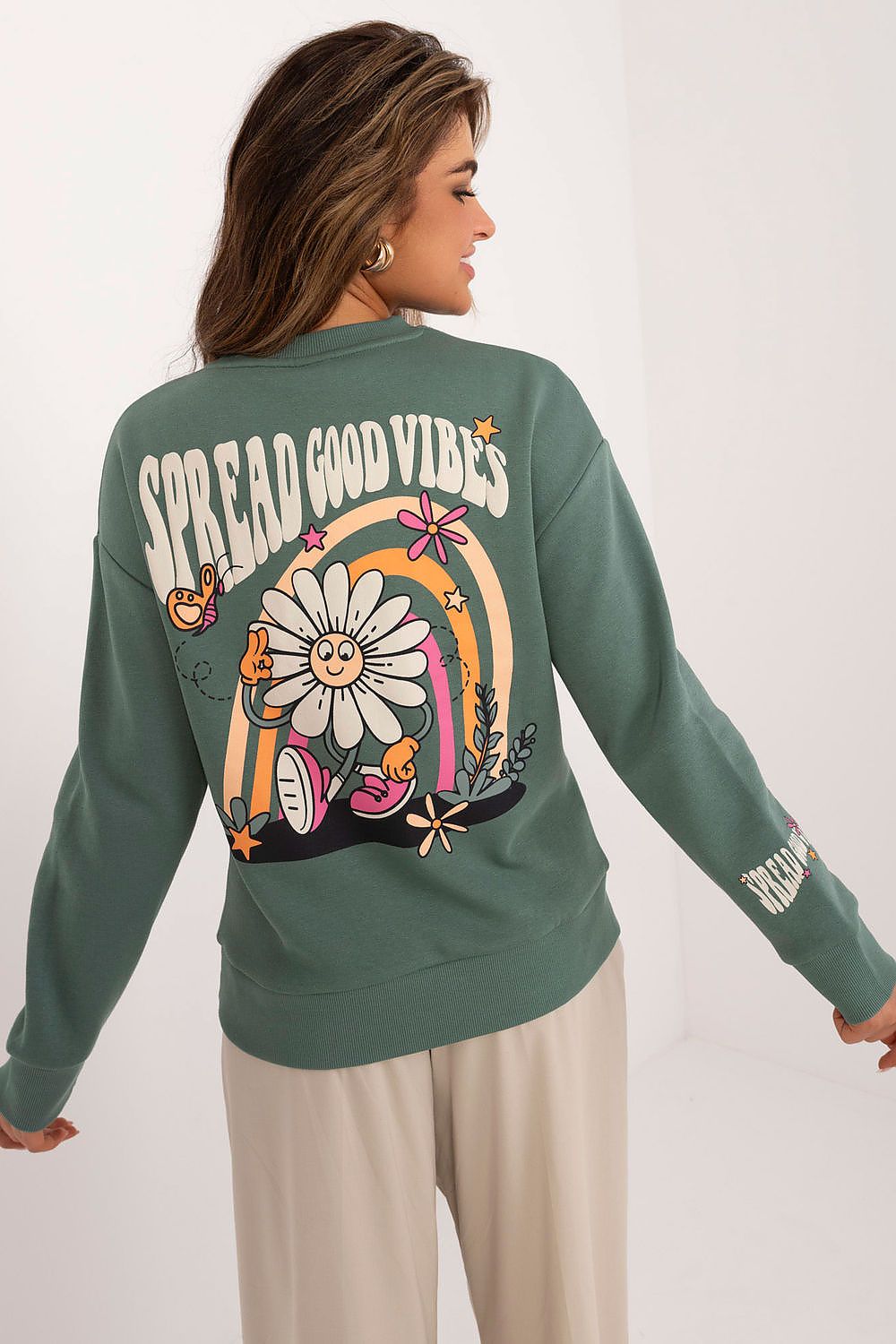 Back view of Sublevel's women's insulated sweatshirt showcasing the unique, vibrant back print that adds a fashionable touch.