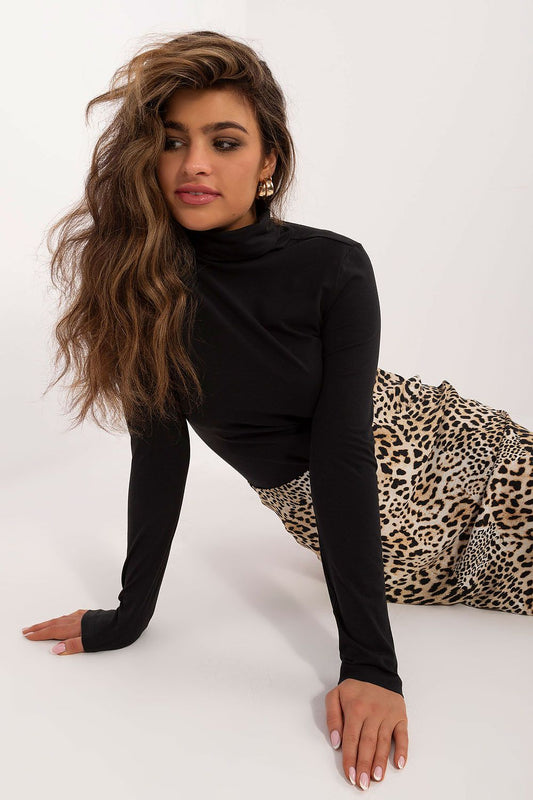 Close-up of the luxurious fabric of Sublevel's turtleneck sweater, highlighting the premium cotton and elastane blend.