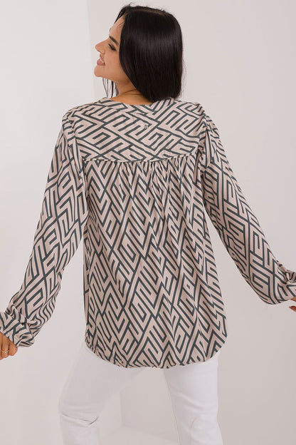 Elegant eco-friendly viscose blouse for women by Sublevel, featuring puffy long sleeves and a sophisticated V-neck design, perfect for casual and office wear.
