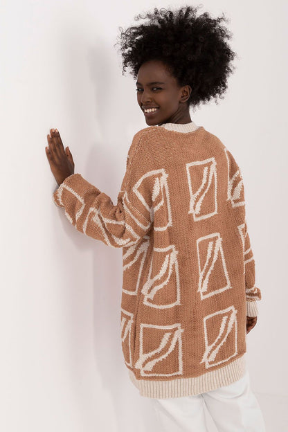Chic long-sleeve women's sweater by Badu, designed with a flattering extended cut and round neckline.