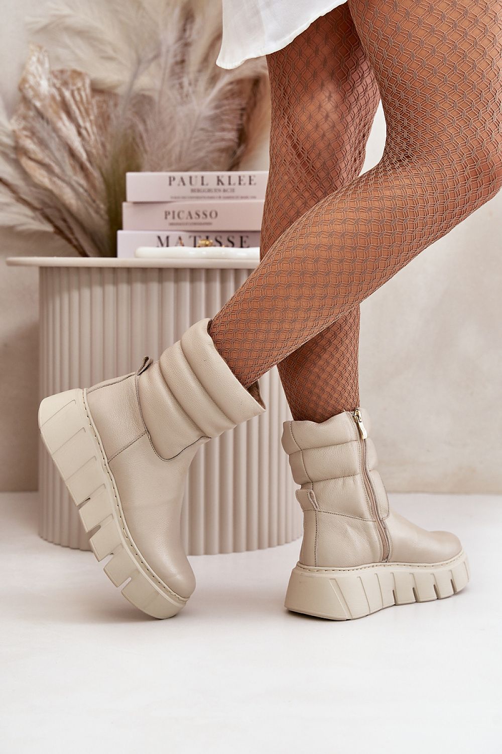 Stylish natural leather ankle boots featuring a rounded toe and sophisticated wedge heel, brought to you by Step in Style.