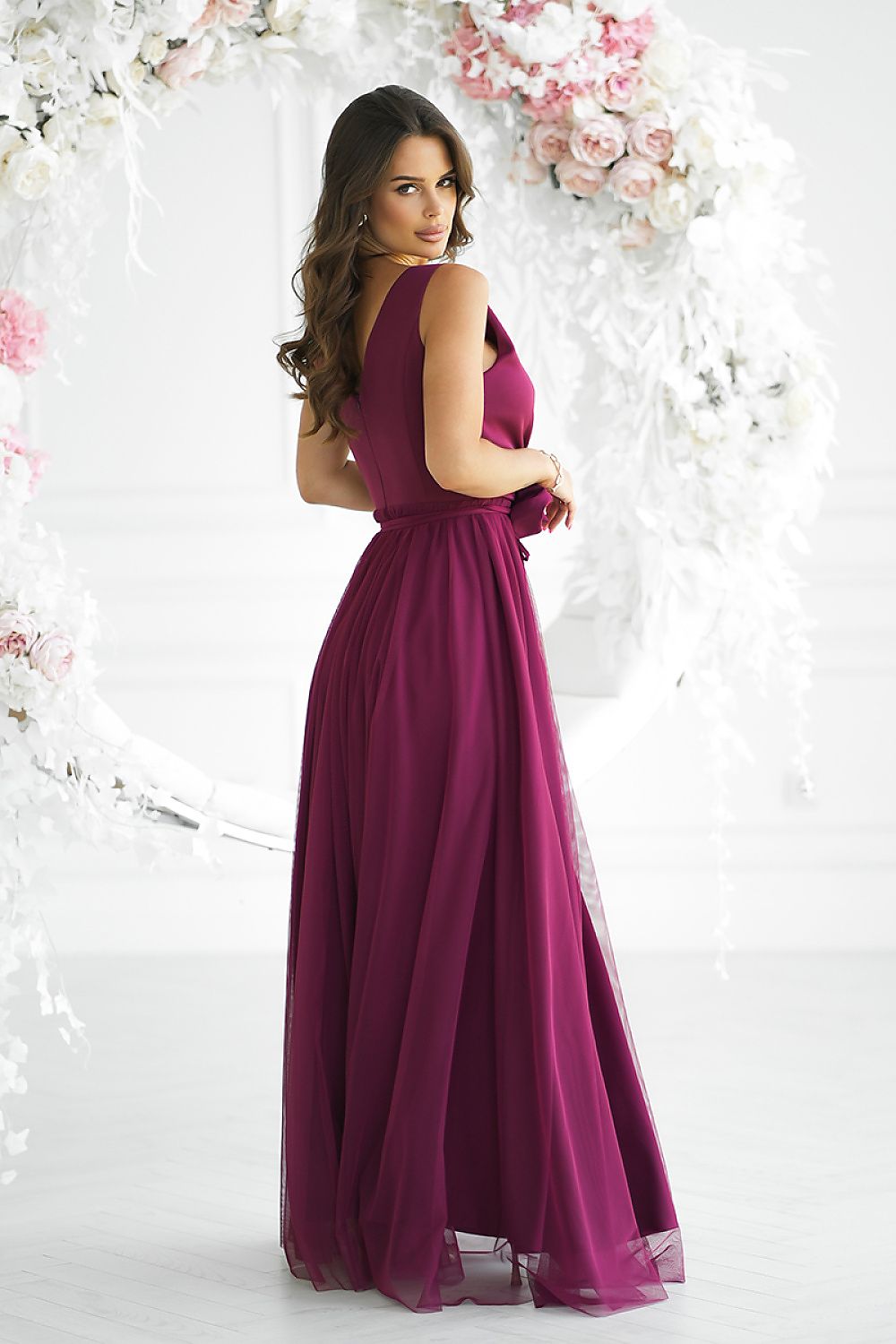 Bicotone's luxurious long dress with a delicate neckline, showcasing exquisite craftsmanship.