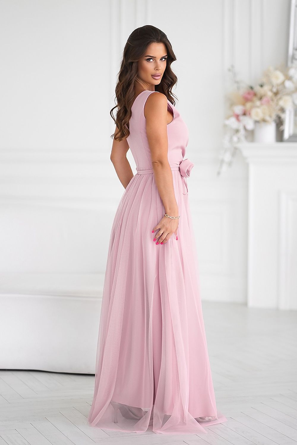 Versatile Bicotone long dress displayed with an elegant rose belt, emphasizing the charm and allure for any special occasion.