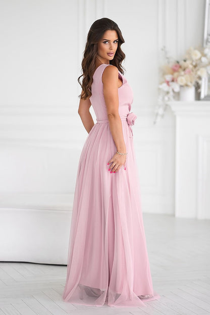 Versatile Bicotone long dress displayed with an elegant rose belt, emphasizing the charm and allure for any special occasion.
