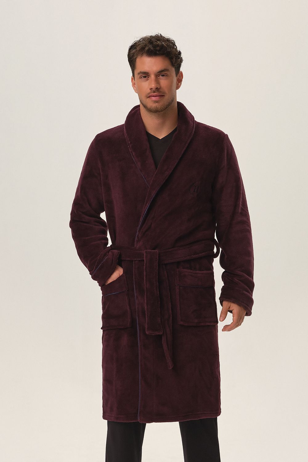 Luxurious burgundy Henderson bathrobe made from soft polyester, featuring knee-length design, comfortable fit, and practical pockets for ultimate relaxation.