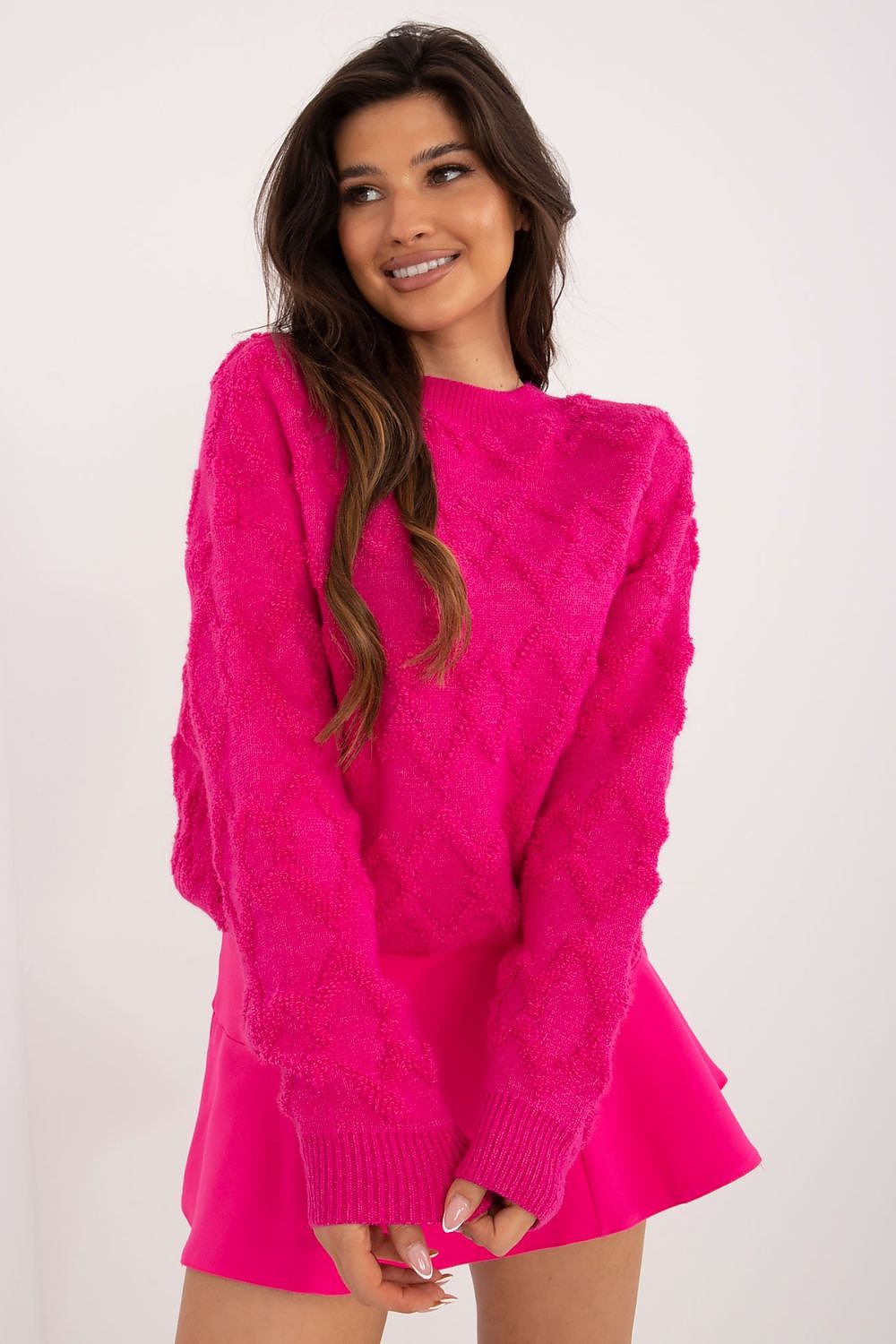 Detailed shot of the fabric composition of AT's women's casual sweater, blending acrylic, nylon, and polyester for ultimate luxury and comfort.