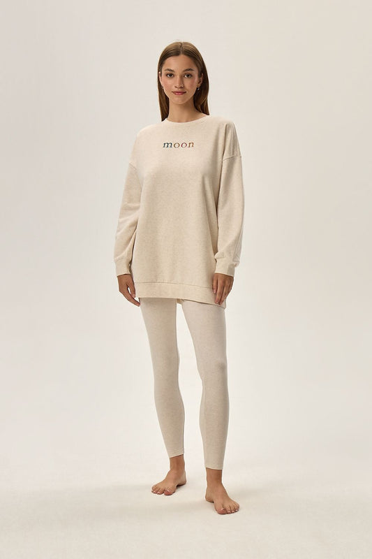 Luxury Henderson Fune Beige Loungewear Set featuring a comfortable top with print and ankle-length leggings, perfect for stylish relaxation.
