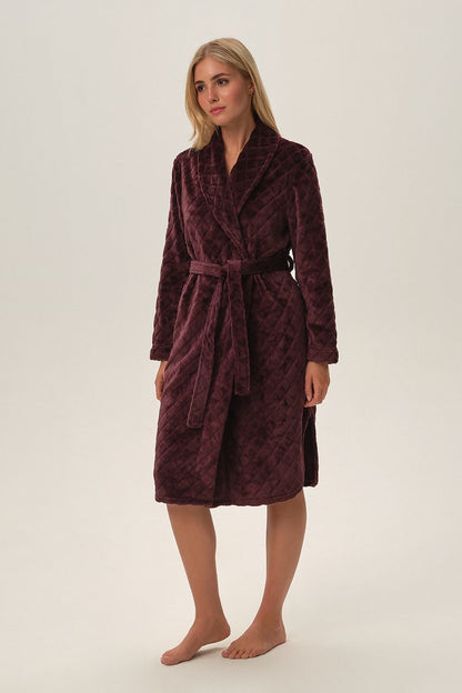 Luxury purple Fyah bathrobe by Henderson featuring a unique design and soft knitwear for ultimate comfort. Highlighting its unconventional deep purple colour, rounded hem, and comfortable fit, this robe is perfect for women seeking elegance and style.