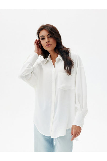 Chic oversized shirt designed by Roco Fashion, crafted in Poland with premium polyester fabric, ideal for versatile styling.