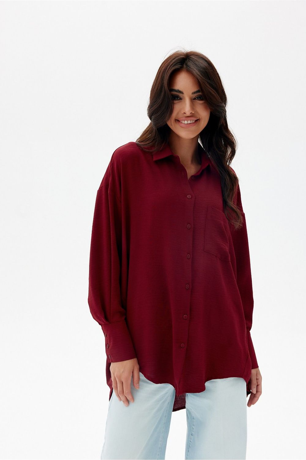 Back view of the oversized shirt by Roco Fashion, demonstrating its flattering loose fit and sophisticated longer back.