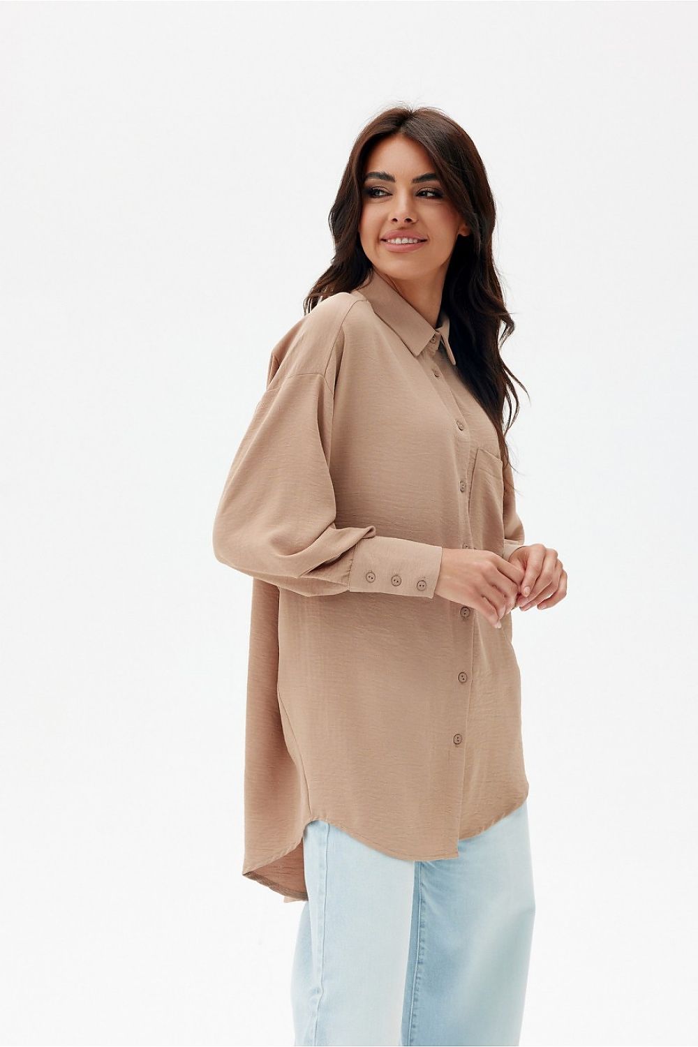 Roco Fashion's elegant oversized shirt highlighted against a minimalist backdrop, emphasizing its unique design elements and luxurious comfort.