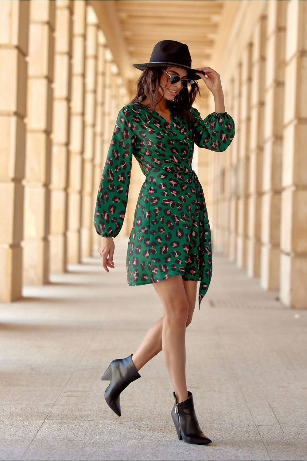 Stylish wrap dress by Roco Fashion, designed with a flattering crossover neckline and mini length to highlight legs elegantly.