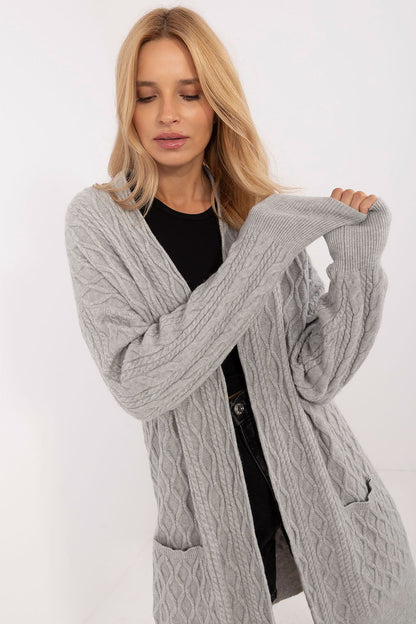 AT's elegant long unbuttoned cardigan with pockets, ideal for cooler days, combining luxurious comfort with contemporary style.