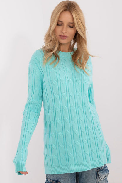 Women's AT casual sweater in a chic ensemble, exemplifying comfort and luxury, perfect for layering on cooler days.