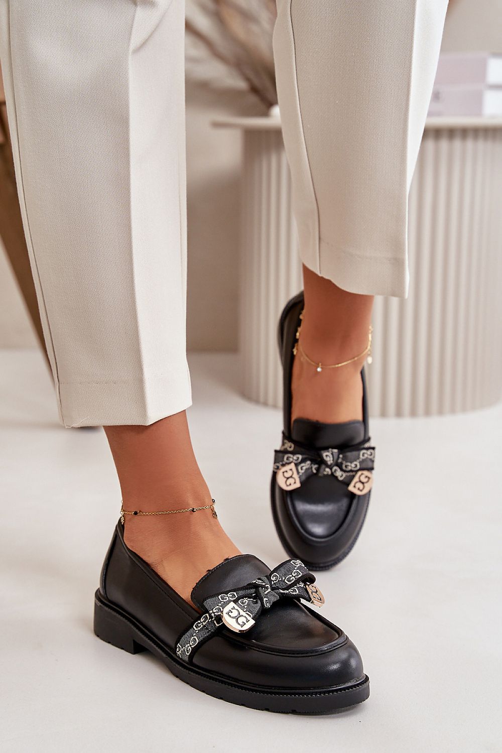 Stylish women's eco-leather loafers with bow detail from Step in Style, designed for elegance and comfort, suitable for daily wear.