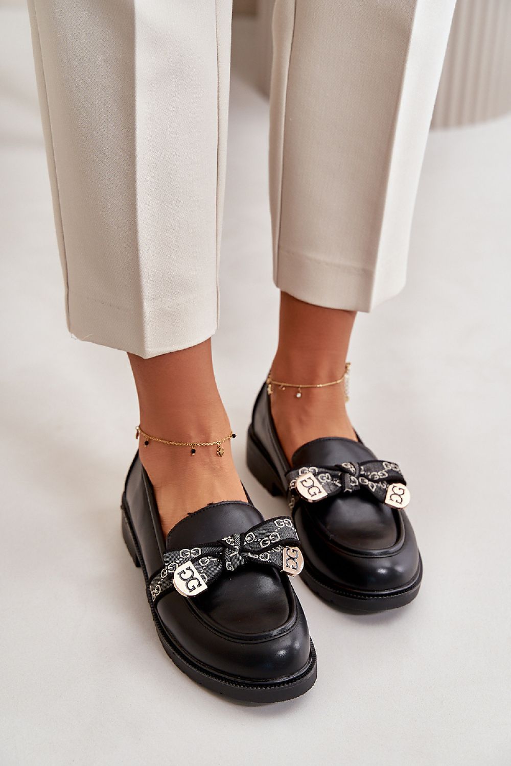 Elegant flat-heeled women's loafers in eco-leather by Step in Style, highlighting the charming bow detail and stylish design for modern wardrobes.