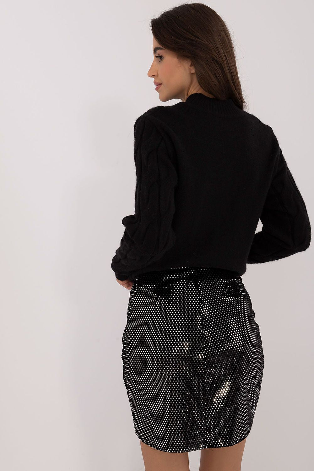 Luxurious shiny mini skirt by Badu, made from a blend of premium materials, perfect for stylish parties and special occasions.