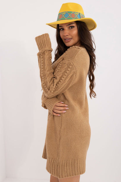 Badu's chic long women's sweater displayed on a model, highlighting its premium acrylic material and versatility for both work and leisure.