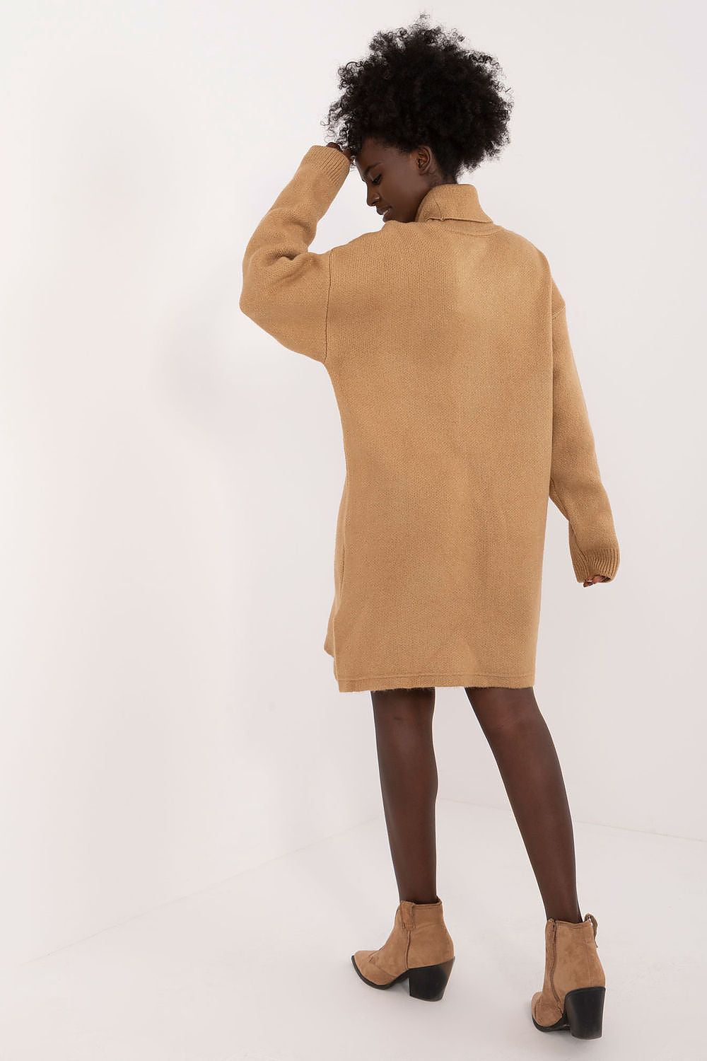 Stylish back view of Badu's Elegant Mini Dress, highlighting the long sleeves and relaxed fit for everyday elegance.