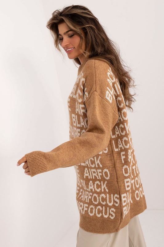 Close-up of Badu's long acrylic sweater showcasing intricate print details, perfectly suited for sophisticated yet casual fashion.
