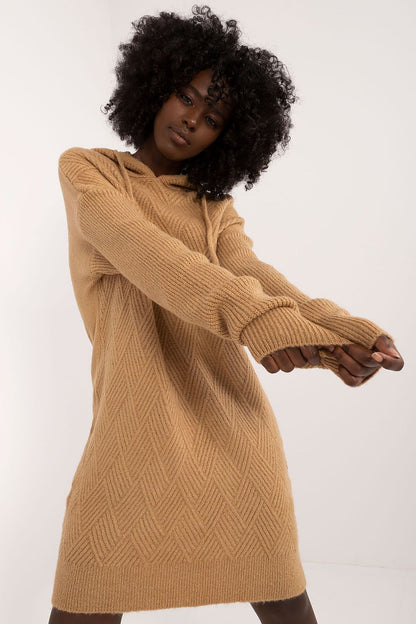 Elegantly styled casual knitted mini dress with hood by Badu, showcasing a luxurious acrylic blend for comfort and warmth.