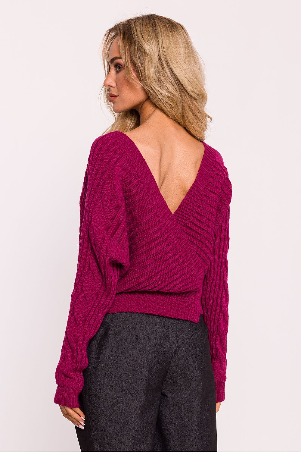 Model wearing Moe's elegant striped knit jumper with a wrap-over style, highlighting its luxurious design and perfect fit for various occasions.