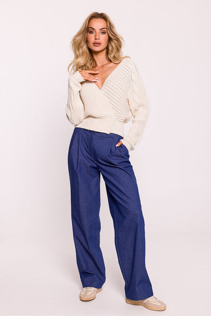 Detailed view of the stitching and texture of Moe's high-quality striped knit wrap-over jumper, embodying elegance and craftsmanship.